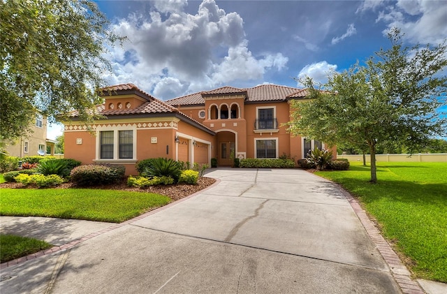 mediterranean / spanish-style house with a front lawn