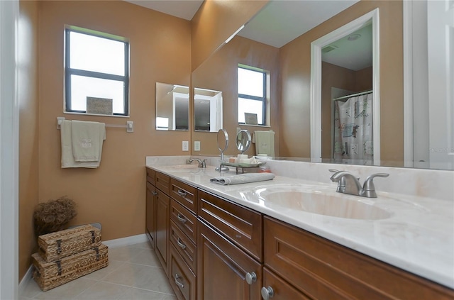 bathroom with tile patterned flooring and vanity