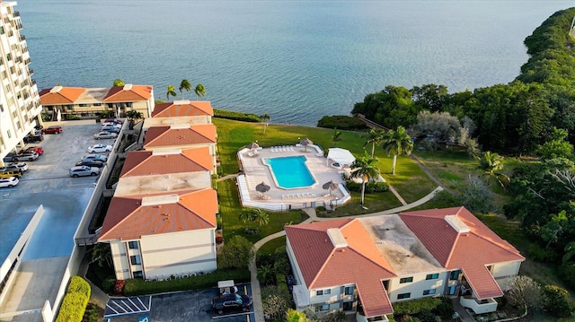 birds eye view of property with a water view