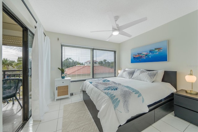 tiled bedroom featuring ceiling fan, a textured ceiling, and access to outside