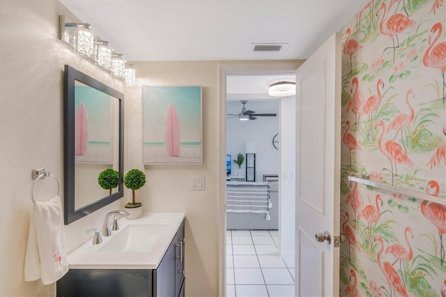 bathroom with ceiling fan, tile patterned flooring, and vanity