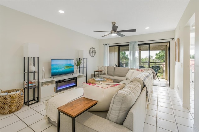 tiled living room featuring ceiling fan