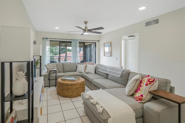 tiled living room with ceiling fan