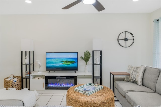 living room with ceiling fan and light tile patterned floors