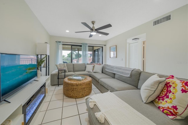 living room with ceiling fan and light tile patterned flooring