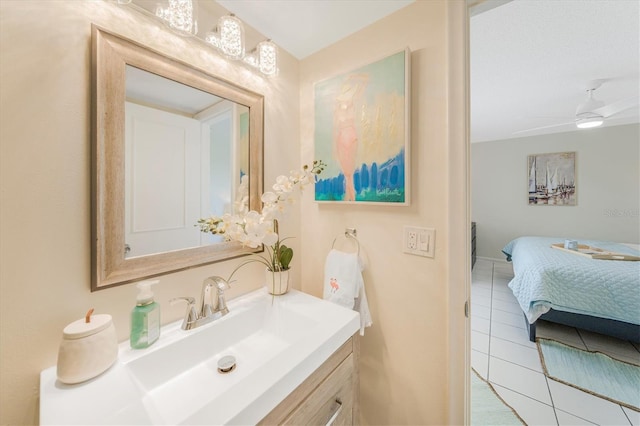 bathroom featuring tile patterned floors, vanity, and ceiling fan