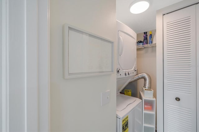 laundry area with stacked washer / dryer