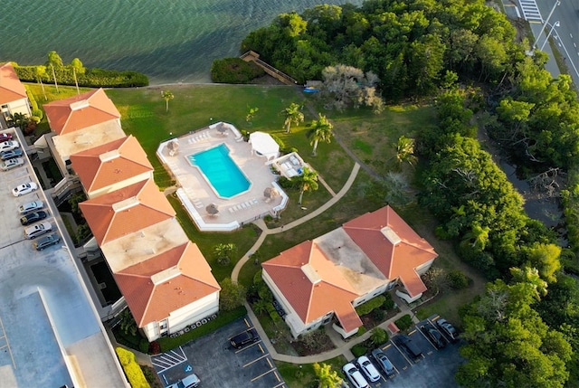 birds eye view of property with a water view