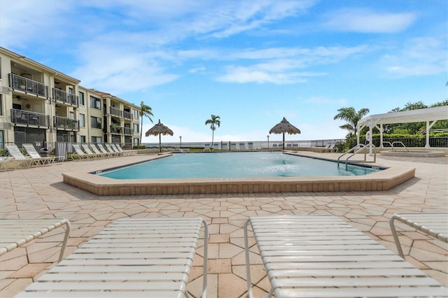 view of swimming pool with a patio area