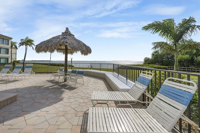 view of patio with a water view