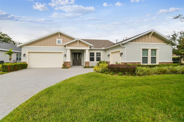 craftsman-style home with a front yard and a garage