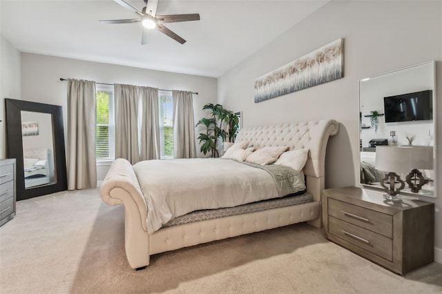 bedroom with light carpet and ceiling fan