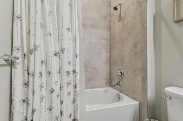 full bathroom featuring shower / bath combination and toilet