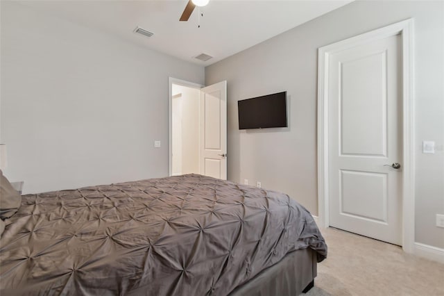 bedroom featuring light colored carpet, visible vents, and ceiling fan