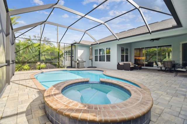 view of pool with a ceiling fan, a patio, grilling area, a lanai, and a pool with connected hot tub