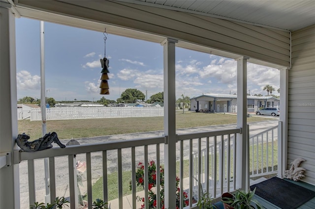 unfurnished sunroom featuring vaulted ceiling