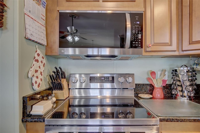 kitchen with ceiling fan and appliances with stainless steel finishes