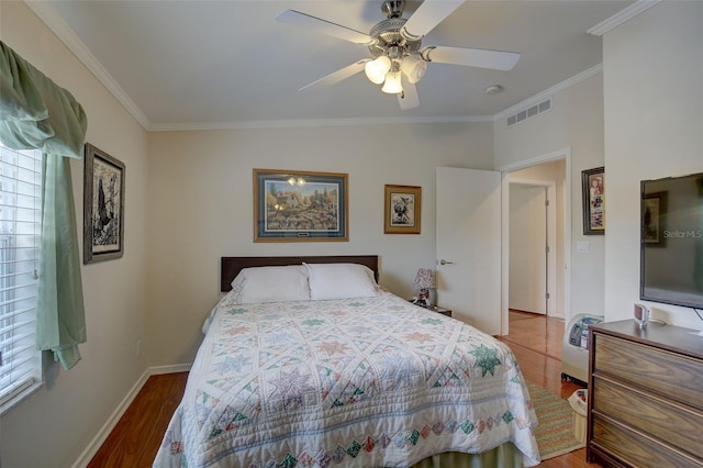 bedroom with ceiling fan, hardwood / wood-style flooring, and crown molding