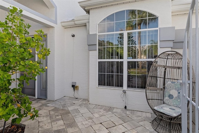 property entrance with a patio area