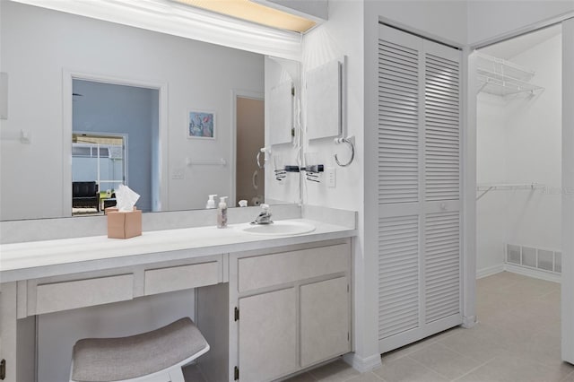 bathroom with vanity and tile patterned floors