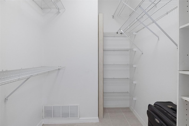 walk in closet featuring light tile patterned floors