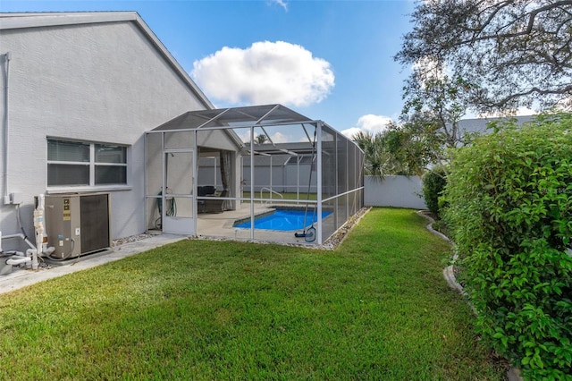 view of yard with glass enclosure