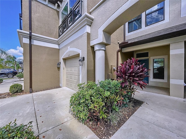 entrance to property featuring a garage