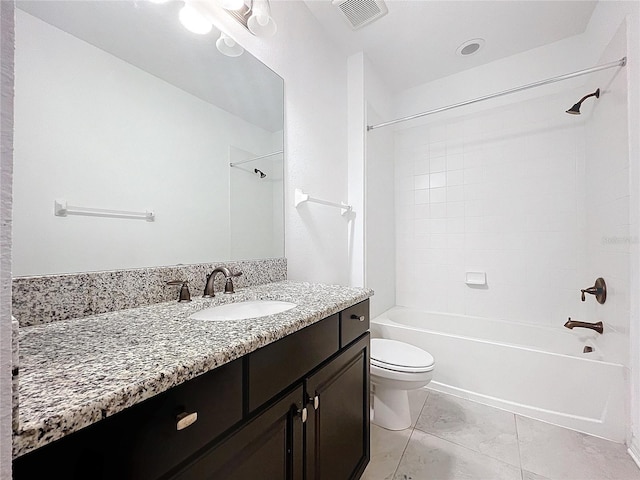 full bathroom with vanity, toilet, and tiled shower / bath combo