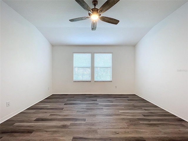 spare room featuring dark hardwood / wood-style floors and ceiling fan