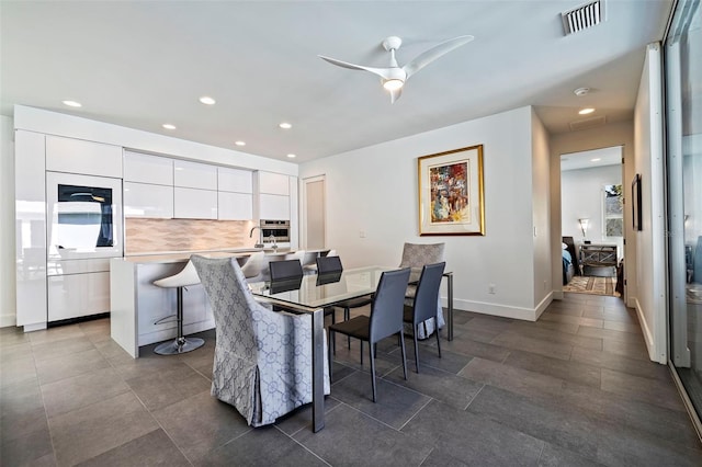 dining area with sink and ceiling fan