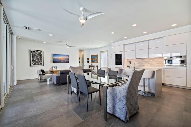 dining space with ceiling fan