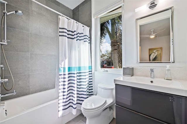 full bathroom featuring vanity, tile patterned floors, toilet, and shower / tub combo with curtain