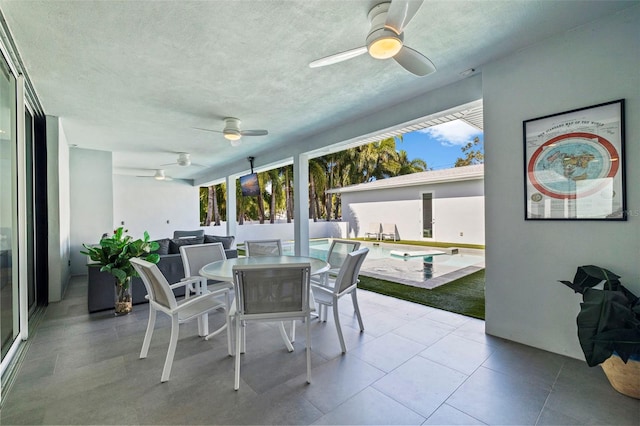 sunroom / solarium with ceiling fan