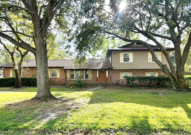 tri-level home featuring a front yard