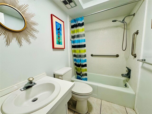 full bathroom featuring toilet, shower / bath combo, vanity, and tile patterned flooring