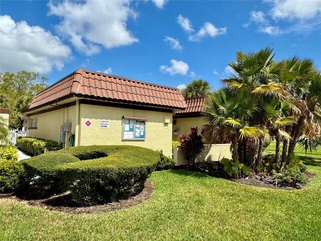 view of property exterior featuring a yard