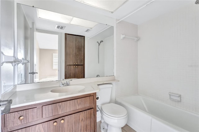 full bathroom with vanity, toilet, and tiled shower / bath combo