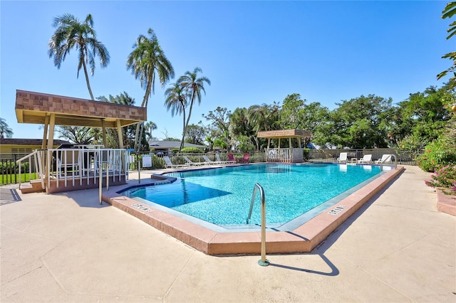 view of swimming pool with a patio