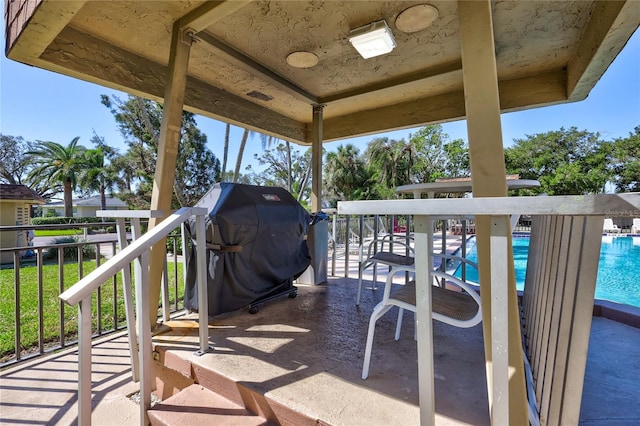 view of patio with a community pool