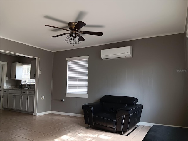 living area with a wall unit AC, ornamental molding, ceiling fan, and light tile patterned floors