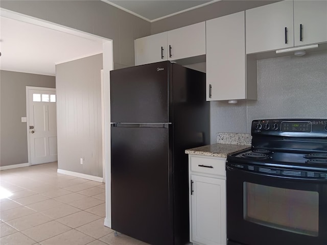 kitchen featuring white cabinetry, light stone countertops, light tile patterned flooring, black appliances, and crown molding