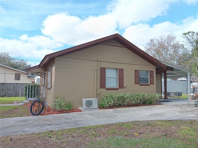 view of property exterior featuring a patio area and ac unit