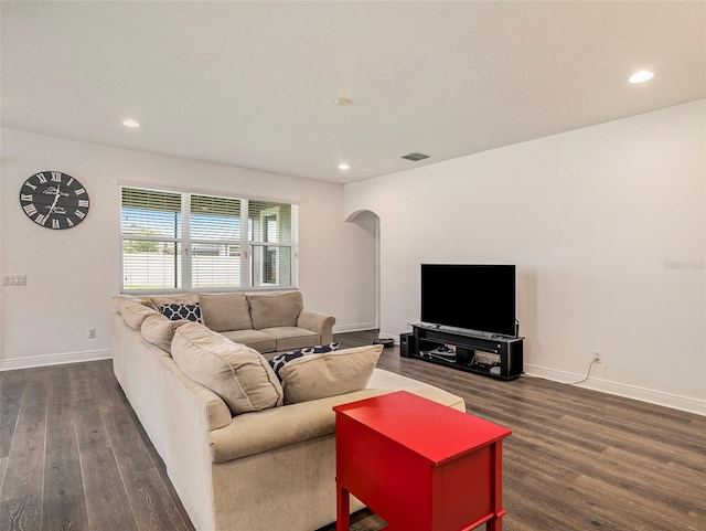 living room featuring dark hardwood / wood-style flooring