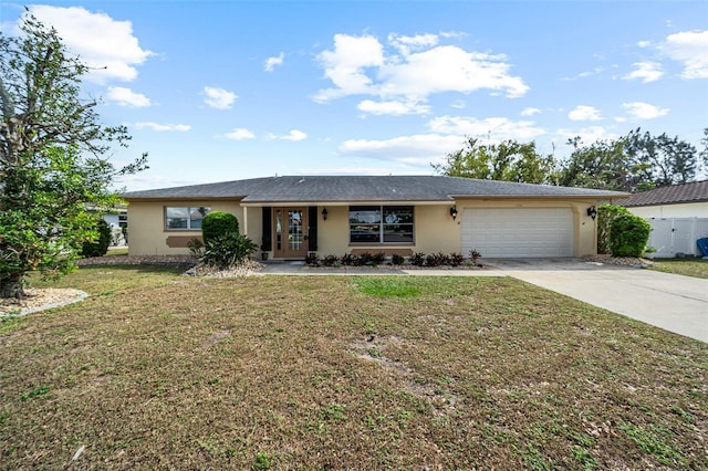 single story home featuring a garage and a front yard