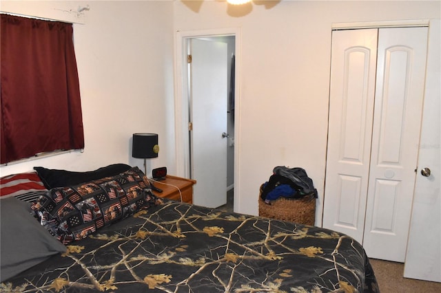 carpeted bedroom featuring a closet