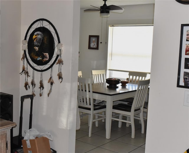 tiled dining room with ceiling fan