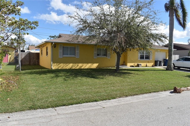 single story home featuring a front lawn