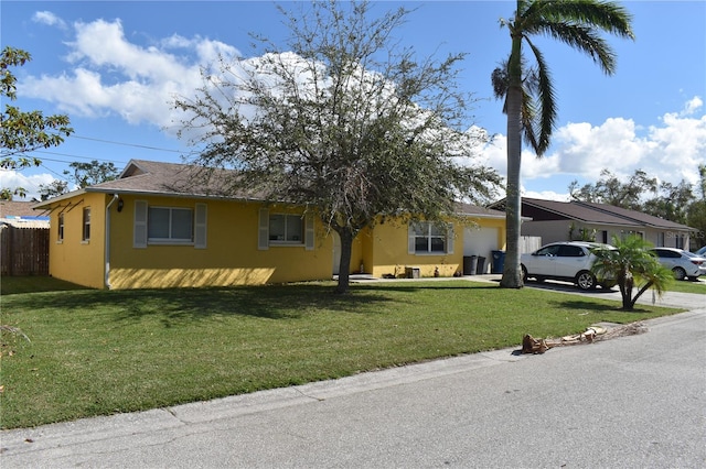 ranch-style house with a front lawn