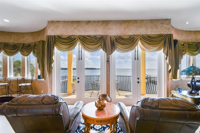 interior space featuring french doors and a water view