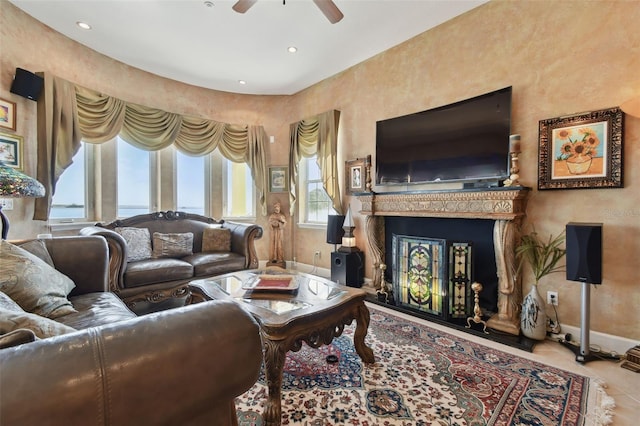 tiled living room featuring ceiling fan